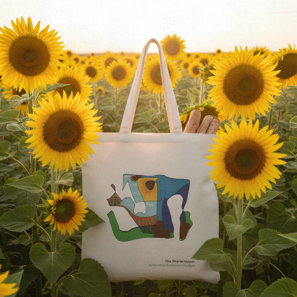 Canvas tote bag featuring The Sharecropper artwork, summer lifestyle setting