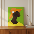 Annabelle's New Hat canvas print on oak sideboard with books and vase — Black woman church hat wall art