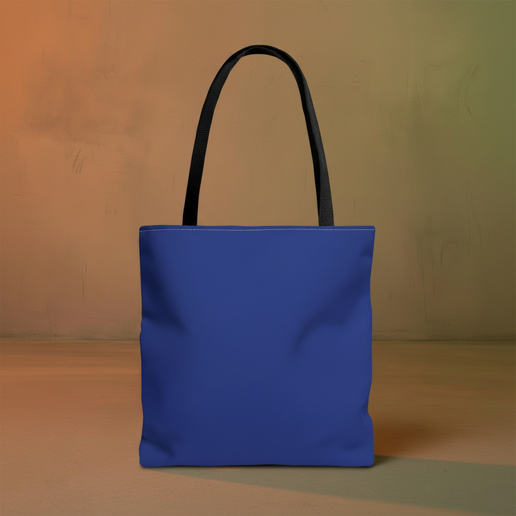 Back view of Dance of the Dougla tote bag showing solid cobalt blue lining and black cotton handles