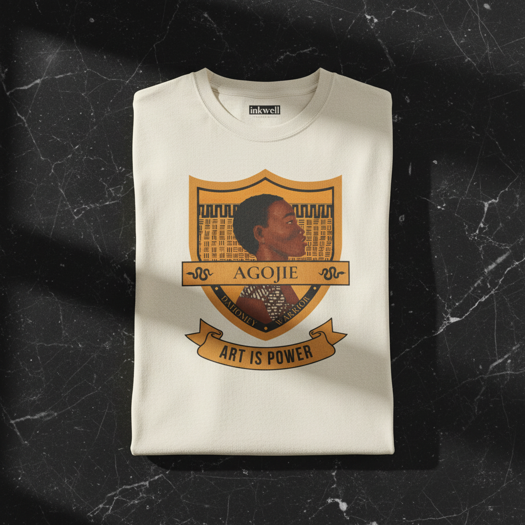 Dahomey Warrior oatmeal tee folded on marble — Art Is Power Vol. I | Inkwell Fine Art Prints