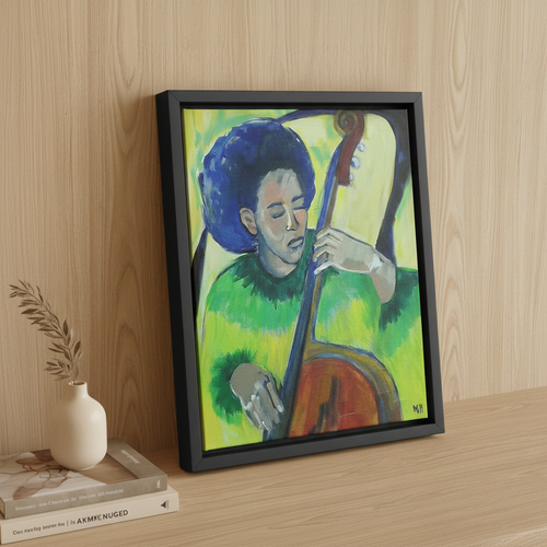 In Tune bassist framed canvas print black frame on sideboard leaning with books and vase — Black music art