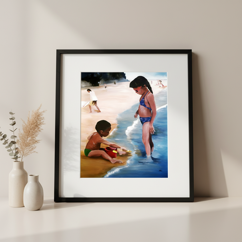 Framed artwork of two children playing on a beach.