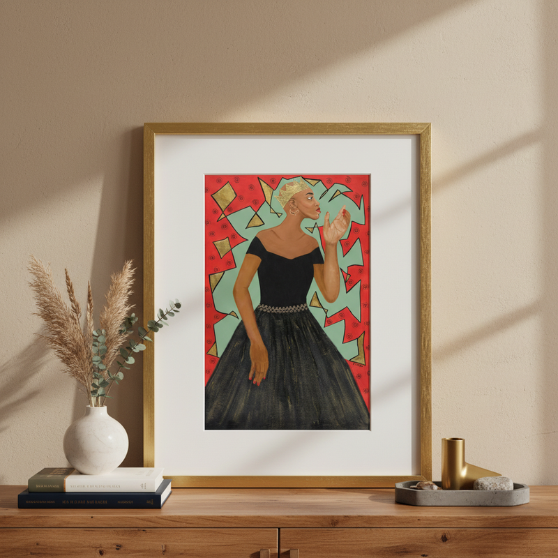 Framed artwork of a woman in a black dress on a wooden surface with decorative items.