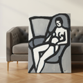 The Model canvas print Dutch tilt view against gray sofa with herringbone floor — Black figurative wall art