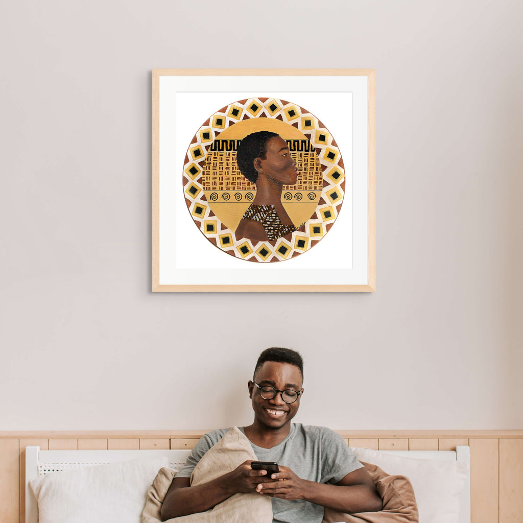 A Dahomey Warrior framed giclee print displayed above a sofa — African heritage wall art