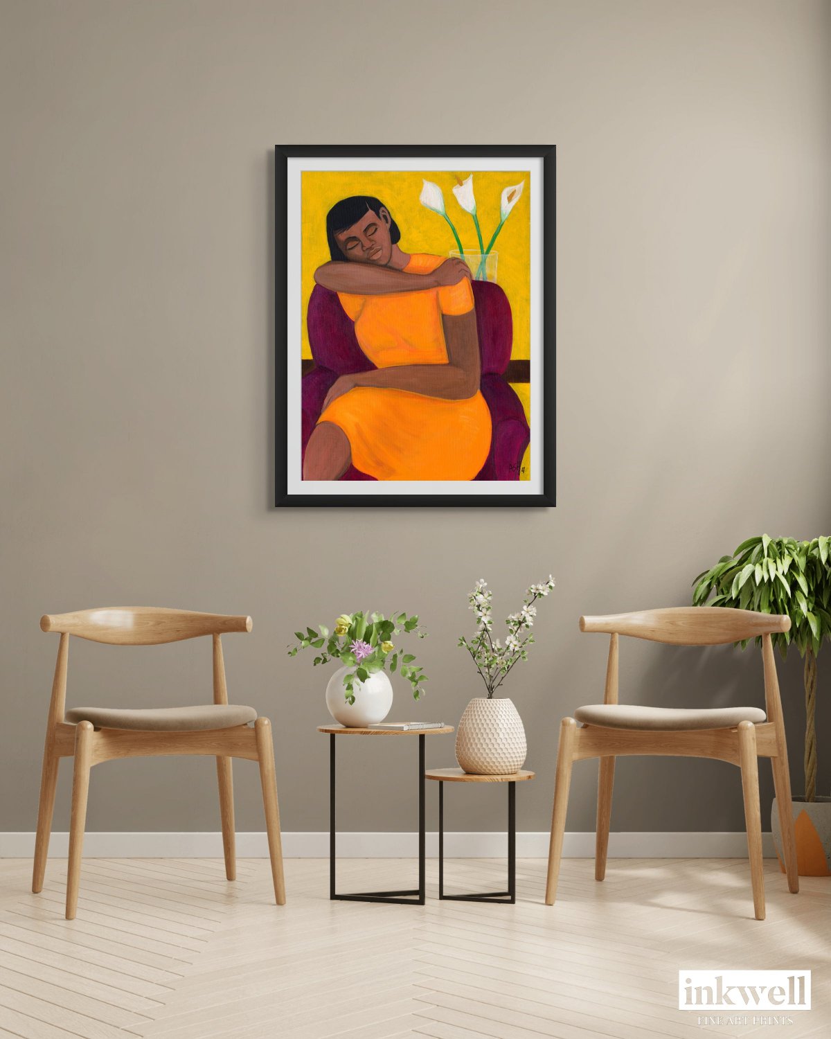 contemporary black art A quiet Moment print framed in 1.25 width black wood frame in a sitting room with 2 chairs and plants