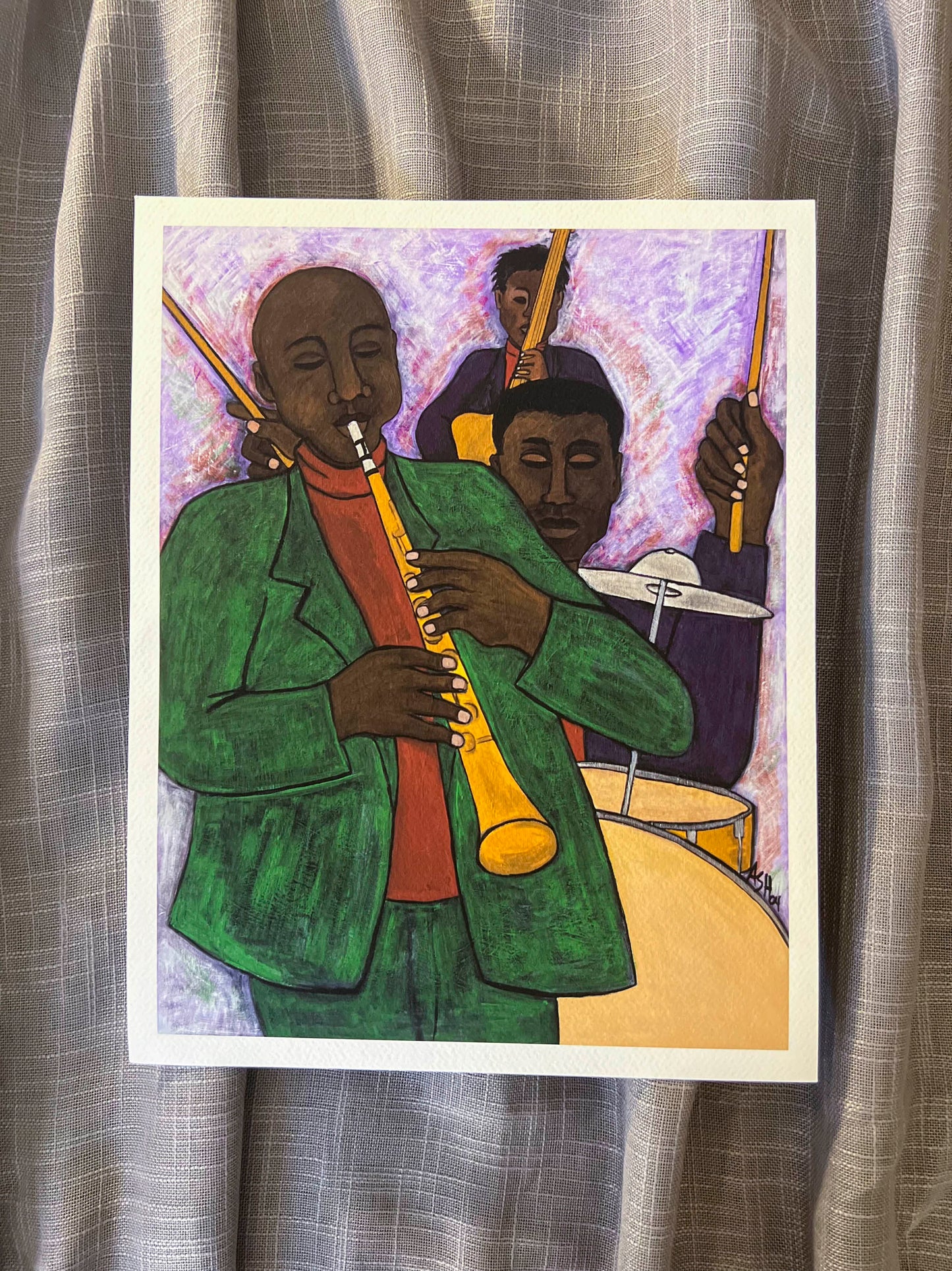 'the Three Musicians' paper print: Three figures in a jazz ensemble, dressed in colorful attire, capturing the rhythm and energy of a musical performance.