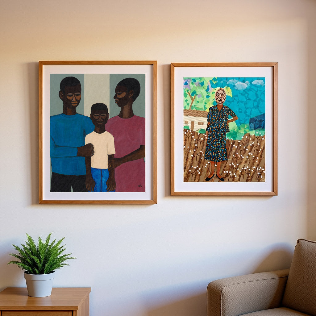 2 framed prints that are mounted in white. one is a black family with mother, son and father.  the other print is a collage of a lady in a cotton field. they are hung in a simple living room