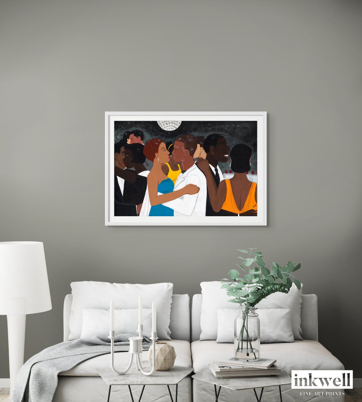 'Black Tie Affair' fine art print: Couple in blue and yellow dress, white suit, amidst elegantly dressed figures against a monochromatic background, showcased on a gray wall above a white loveseat.