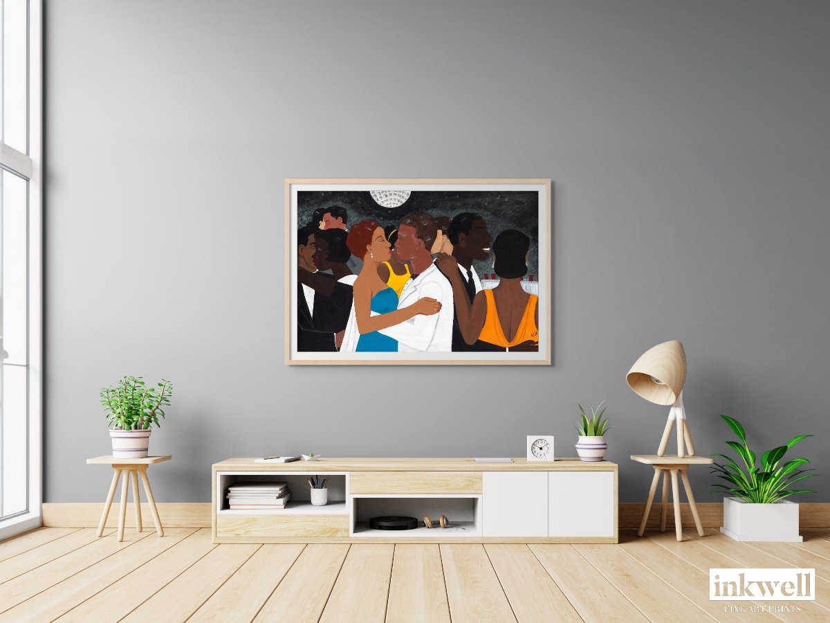 'Black Tie Affair' fine art print: Couple in blue and yellow dress, white suit, among elegantly dressed figures against a monochromatic background, framed in natural wood, displayed on a gray wall above a white and natural wood media center.