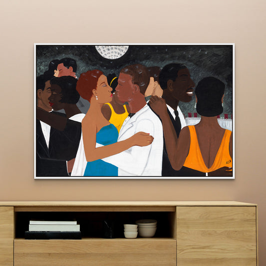 Black Tie Affair framed canvas print by Antionette Simmons Hodges. Captures a lively social gathering with a couple dancing, the woman in a blue and yellow dress, the man in a white suit, set against a monochromatic background.