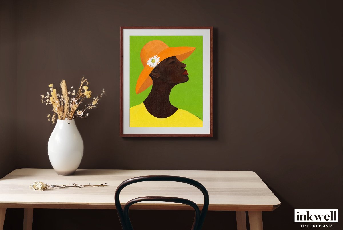 Giclee art print 'Annabelle's New Hat': African American woman in yellow outfit, orange hat with daisy, against green, above wooden table with vase of dried flowers.