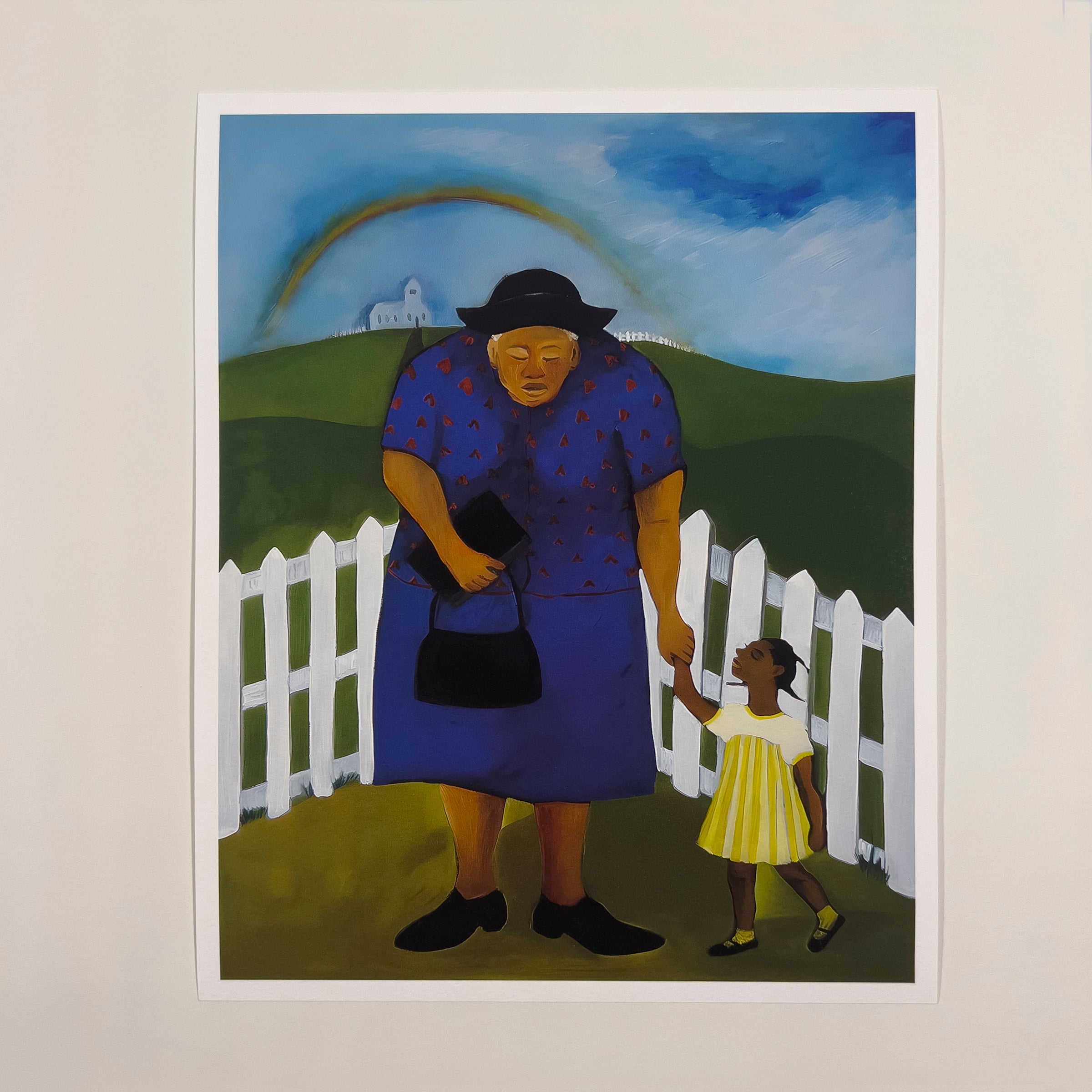 Goin' to Church - African American Faith Artwork - An art print showing a young Black girl in a yellow dress walking hand in hand with her elder toward a white church on a hill, beneath a bright rainbow and blue sky, surrounded by green fields and a white picket fence.