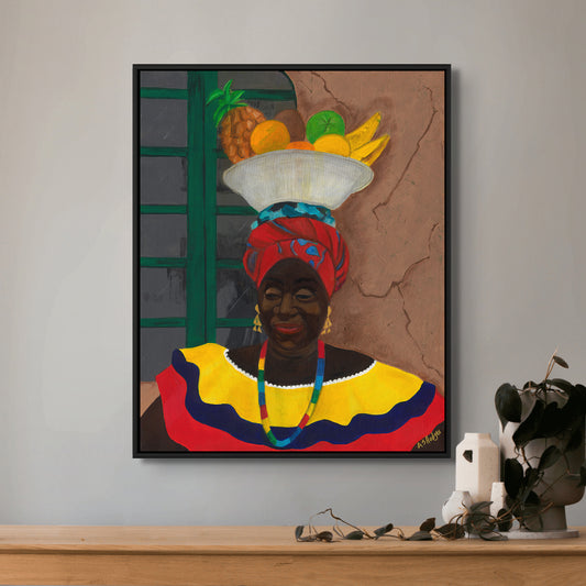 Hey Lady framed canvas print by Antionette Simmons Hodges. Features a Colombian woman in a vibrant red turban and colorful dress, carrying a basket of tropical fruits. Captures the lively spirit and cultural richness of Cartagena. Black art Print