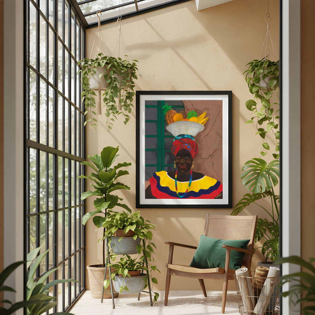 Decorative interior with a colorful framed artwork by Antionette Simmons Hodges,  depicting a Colombian woman fruit vendor, chair, and plants.