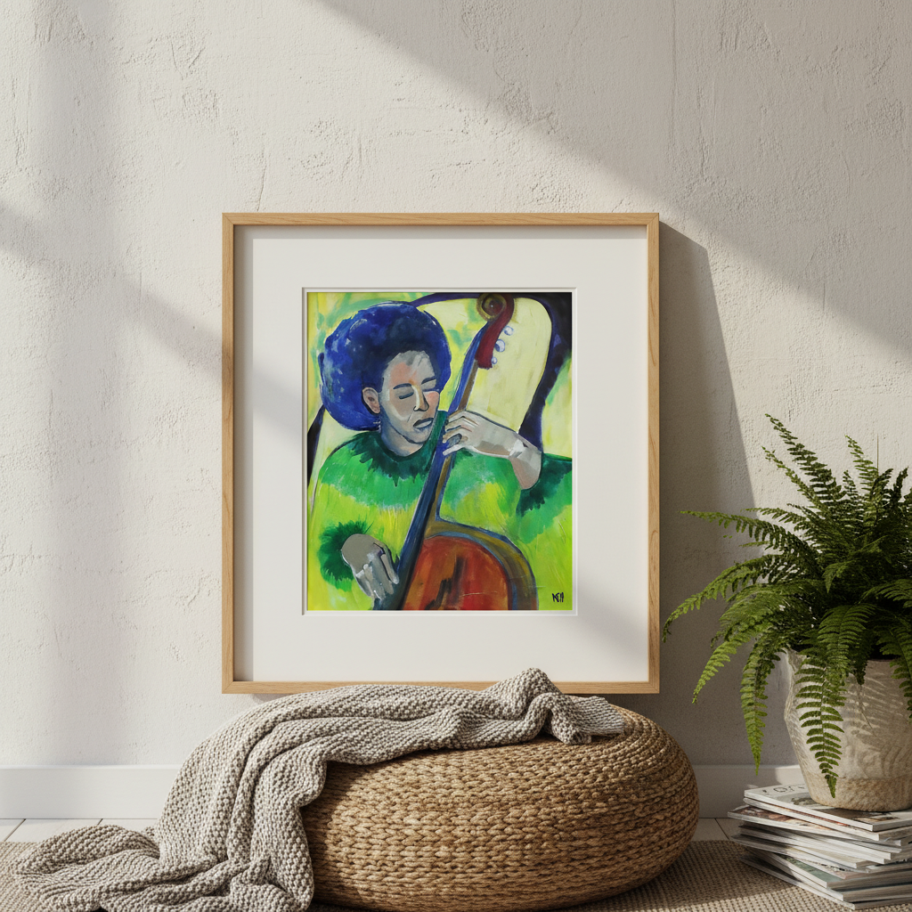 Framed artwork of a person playing a string instrument on a wall with a plant and woven ottoman below.