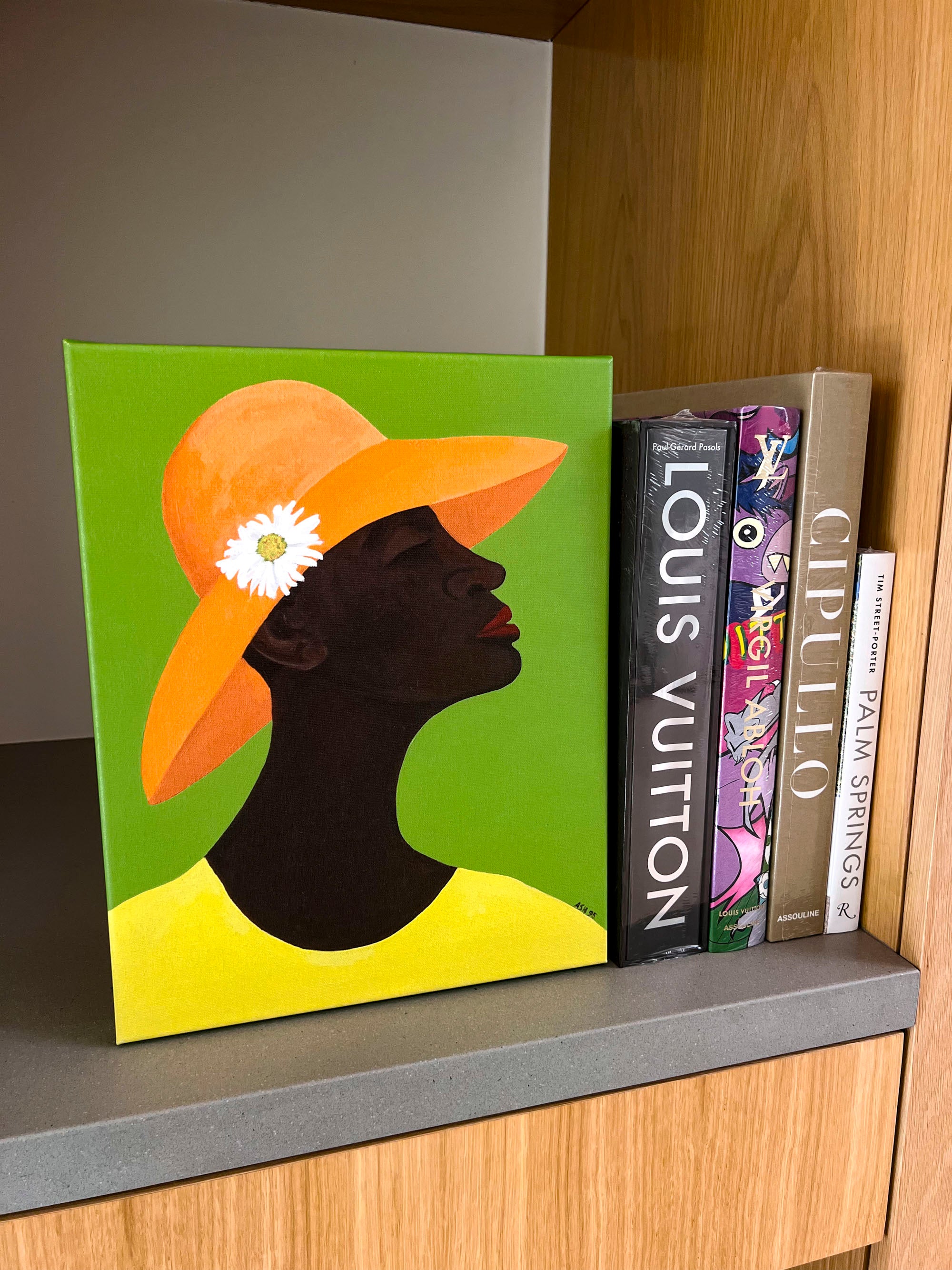 Annabelle's New Hat - Stretched Canvas Print - soulful art.- displayed on counter with books