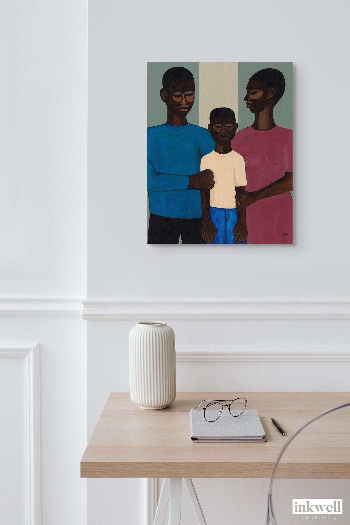 'The Family' stretched canvas artwork: Black family in a stylized depiction, with simplified features and a protective embrace, capturing the essence of unity and strength.