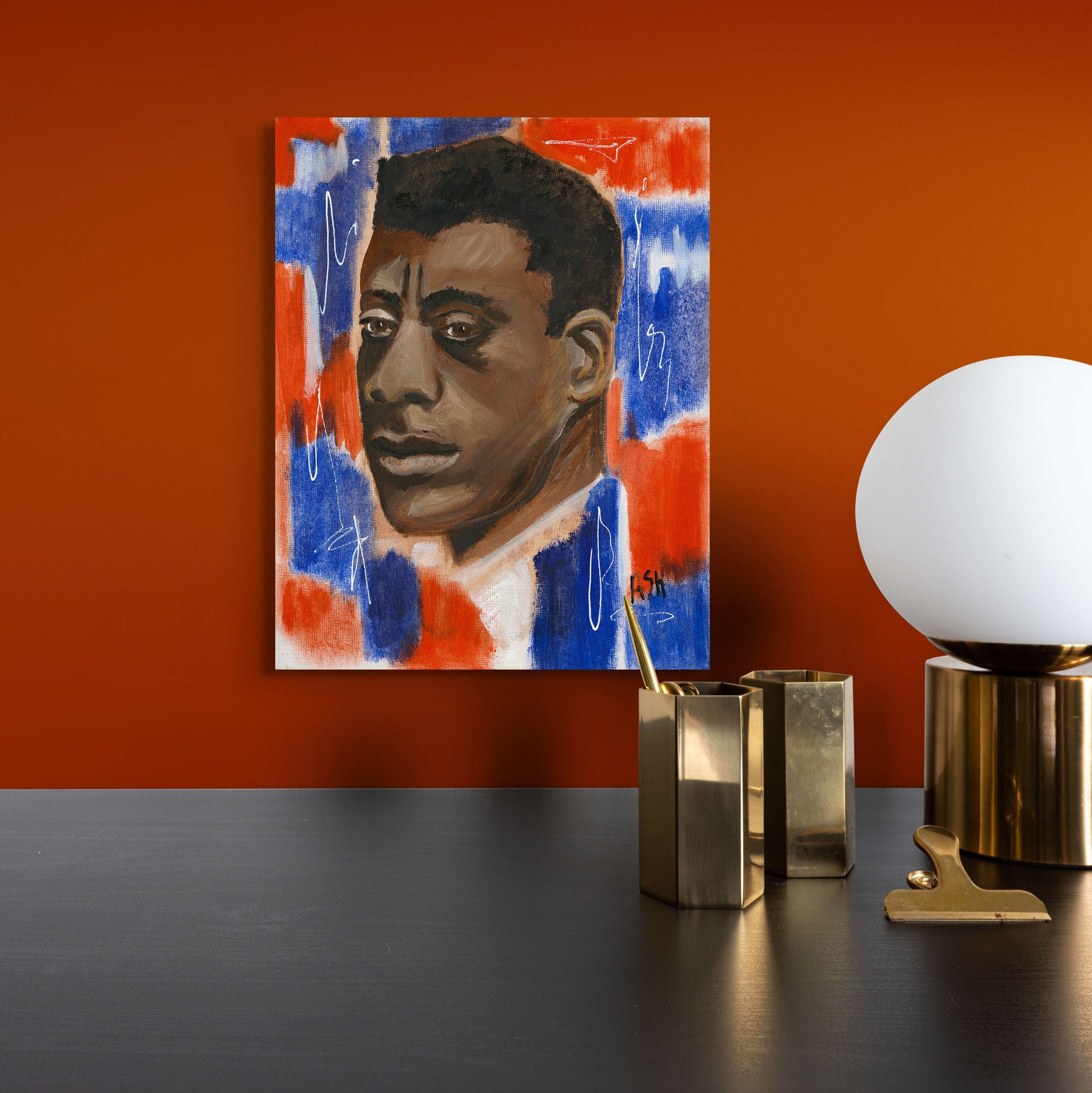 Stretched canvas print of 'Red, White & Blues - James Baldwin,' featuring a portrait of Baldwin against a vibrant red, white, and blue background. The artwork symbolizes patriotism and the emotional depth of the 'blues,' reflecting Baldwin's impact on literature and civil rights.