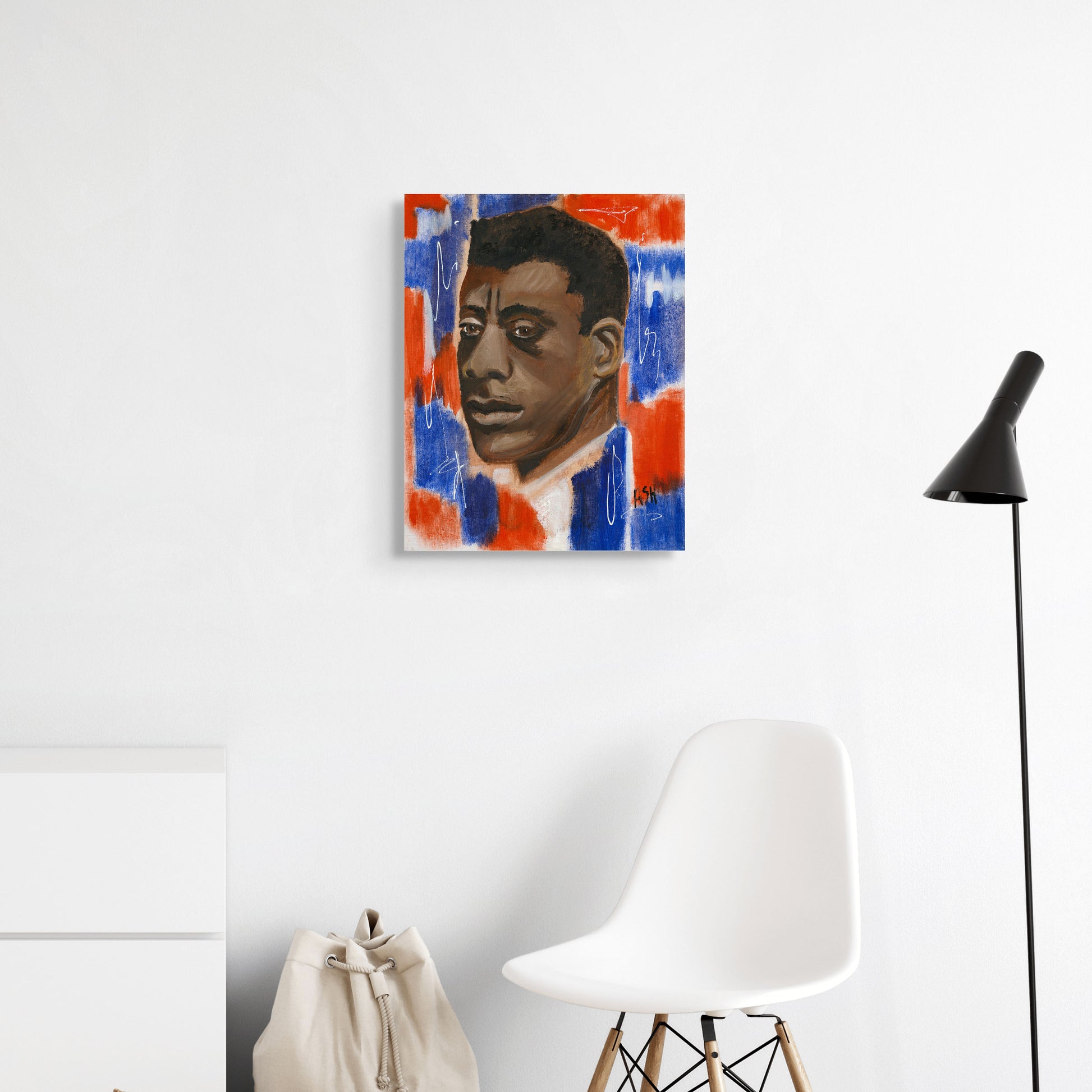 Stretched canvas print featuring James Baldwin against a bold red, white, and blue background. This artwork captures themes of patriotism and the emotional depth of the 'blues,' celebrating Baldwin's significant contributions to literature and civil rights.