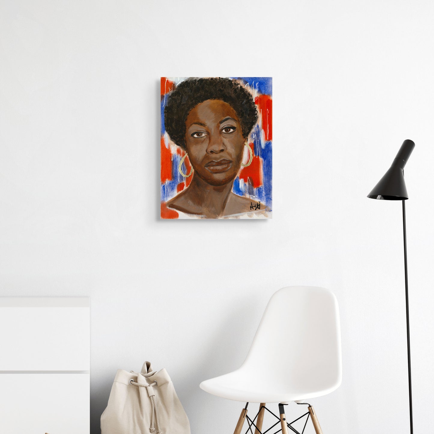 Stretched canvas print of 'Red, White & Blues - Nina Simone,' featuring dynamic red, white, and blue hues. The artwork captures Nina Simone's iconic presence and her impactful role in music and civil rights, with colors symbolizing patriotism and the soulful essence of the 'blues.