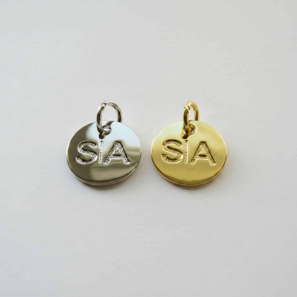 Silver and gold S|A logo charms used on Scott Ashton leather tassels
