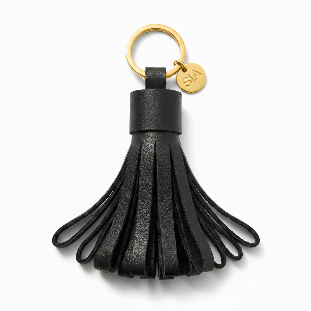 Small black leather tassel keychain with brass ring and brass key ring