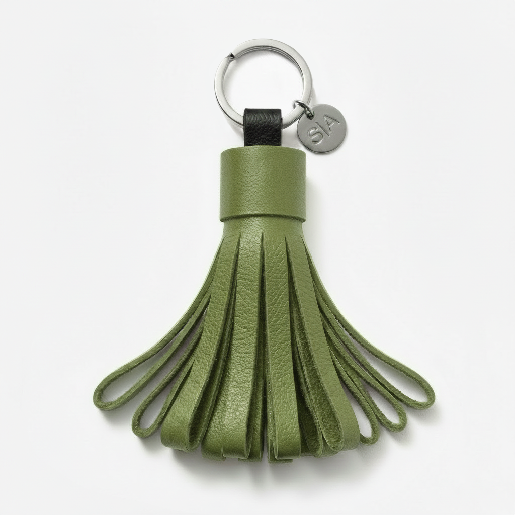 Small green leather tassel keychain with nickel charm and matte black nickel key ring