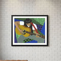 Framed artwork of a person playing guitar on a white brick wall with a brown leather sofa and wooden coffee table.