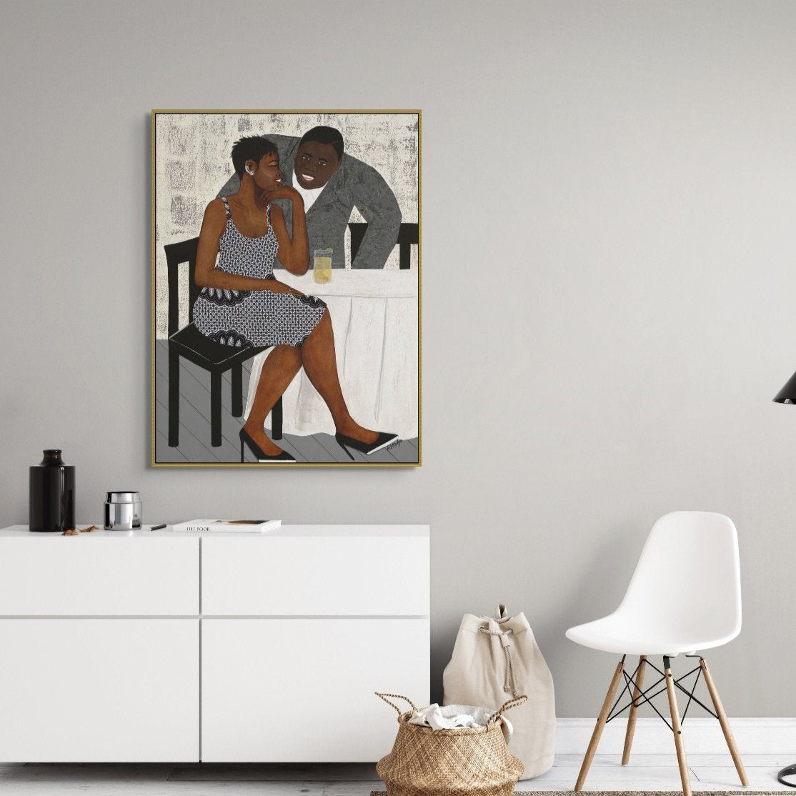 'The Conversation' art print on framed canvas: Black couple in animated conversation, highlighted by colorful fashion and an abstract setting, framed to perfection.