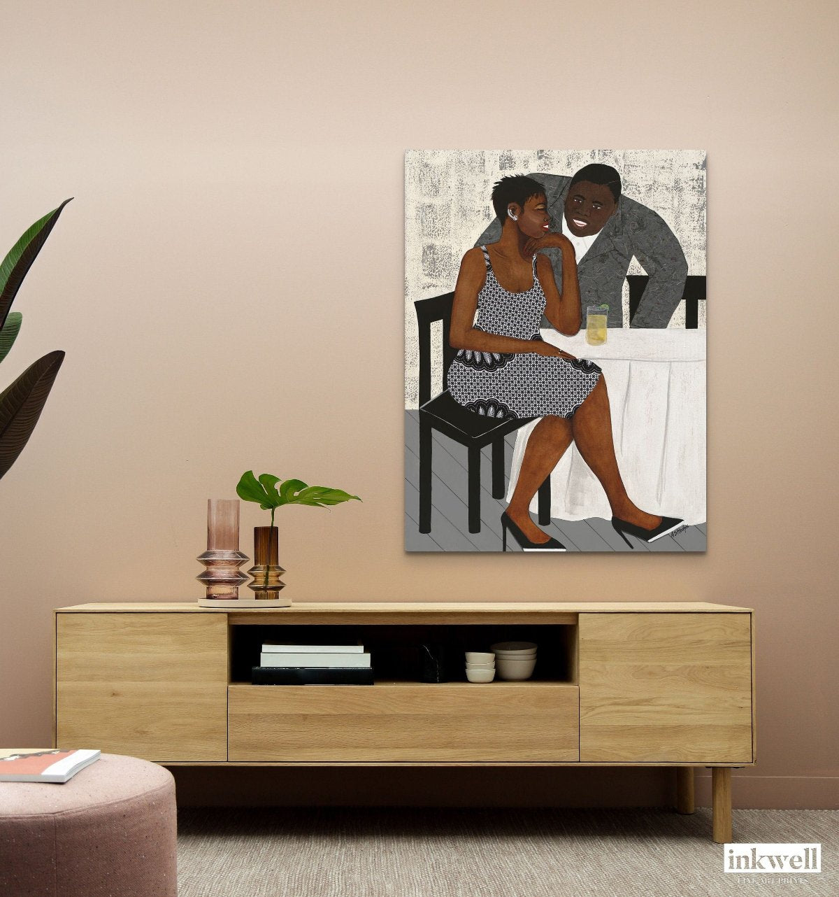 'The Conversation' stretched canvas print: African American couple in vibrant attire, engaged in a heartfelt exchange against a warm, abstract background. shown above wood media unit