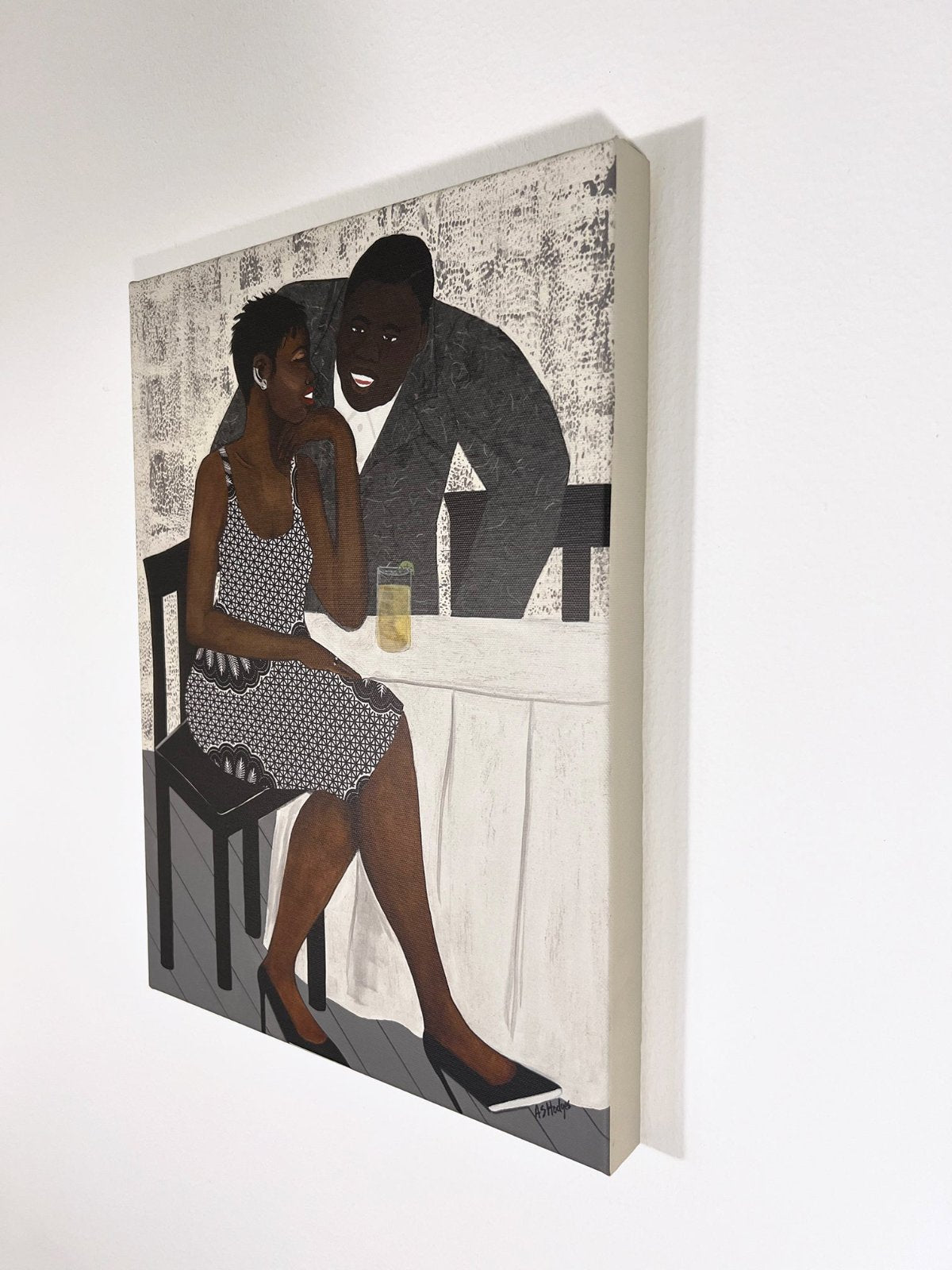 'The Conversation' fine art print: A couple engaged in an intimate dialogue, with the woman in an African-inspired print dress and the man in a gray jacket, set against a warm-toned background. shown on white wall