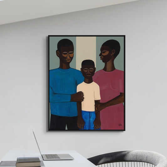 black art print - The Family framed canvas print by Antionette Simmons Hodges. Features three figures—two adults and a child—embracing in a stylized manner, symbolizing unity and strength. Celebrates African American heritage and familial bonds.