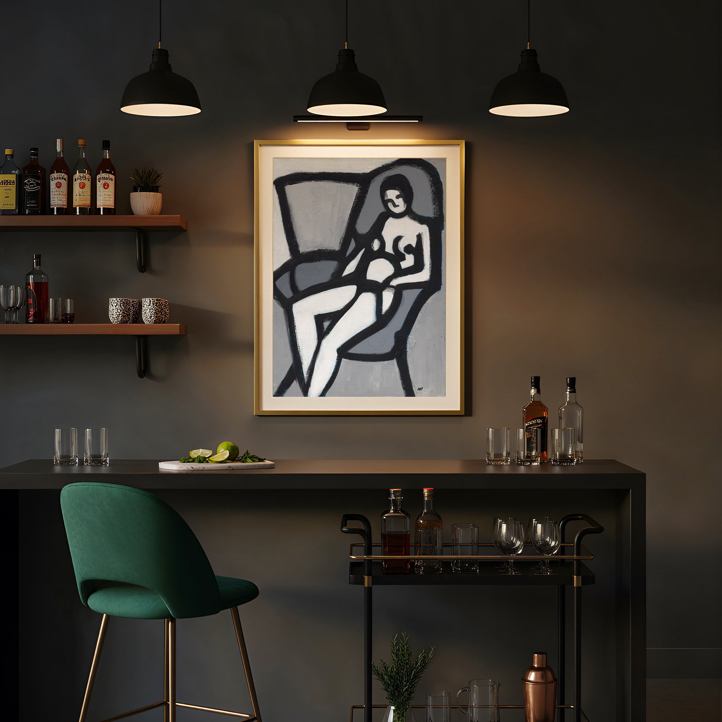Framed abstract nude model artwork on a wall with a bar setup below