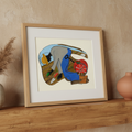 The Urban Gardener continuous line print in oak frame above a mantel, close-up — Black community garden art